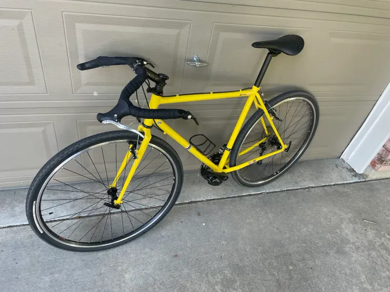 The finished yellow bicycle frame, complete